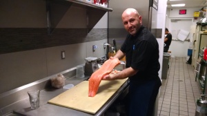 Chef Ferhat Yalçin working with salmon.