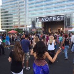 Wine lovers crowd around to dance to VinoFest’s live music performances.