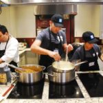 Staff preparing fondue